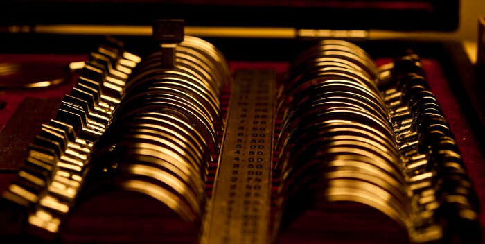 The lenses that help determine new prescriptions for patients are cleaned thoroughly before use June 7, 2013, at Nellis Air Force Base, Nev. The optometrist will select lenses from the case, which will help in the selection of new lenses for the patient. (U.S. Air Force photo by Senior Airman Daniel Hughes)