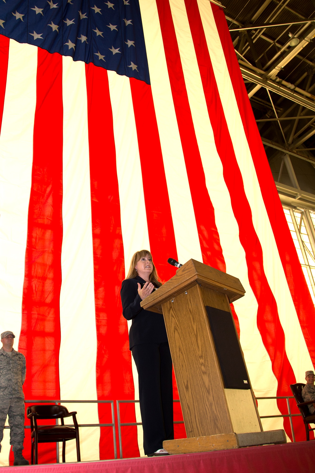 Margaret Fleming, new 412th Maintenance Squadron director, speaks to members of the 412th MXS and base leadership in Hangar 1600 after taking the reigns of the squadron from Tye Lockard June 7. (U.S. Air Force photo by Chris Neill) 