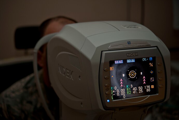 Master Sgt. David Sims, 57th Aircraft Maintenance Squadron first sergeant, has his eyes evaluated by a wavefront aberrometer during a routine eye exam June 7, at Nellis Air Force Base, Nev. The wavefront aberrometer measures the way a wavefront of light passes through the cornea and the crystalline lens, which are the light-focusing components of the eye.  (U.S. Air Force photo by Senior Airman Daniel Hughes)
