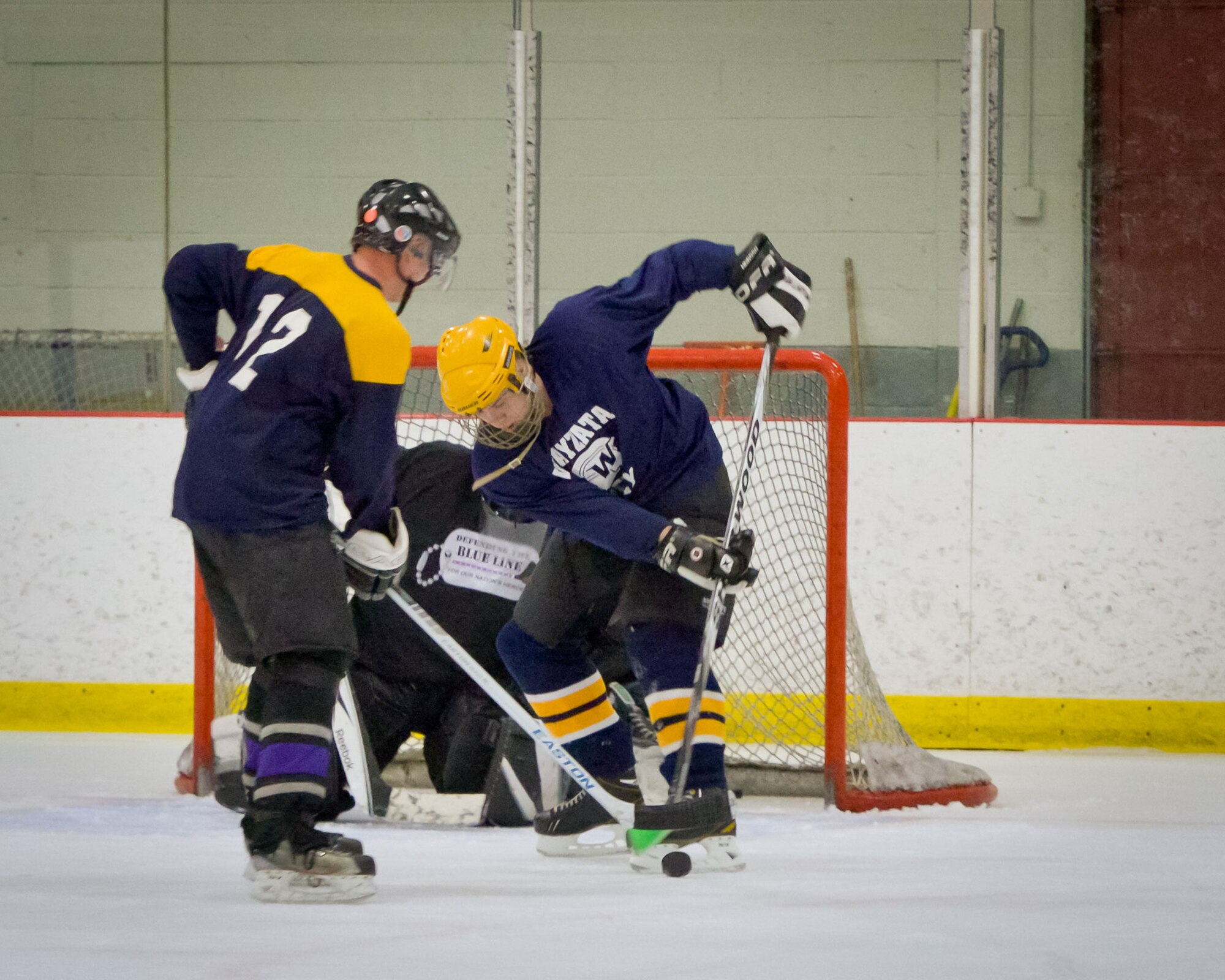 Members of the 934th Airlift Wing play against each other in a friendly game of hockey at the Wakota Civic Arena after the June Unit Training Assembly weekend.  (U.S. Air Force photo/Shannon McKay)