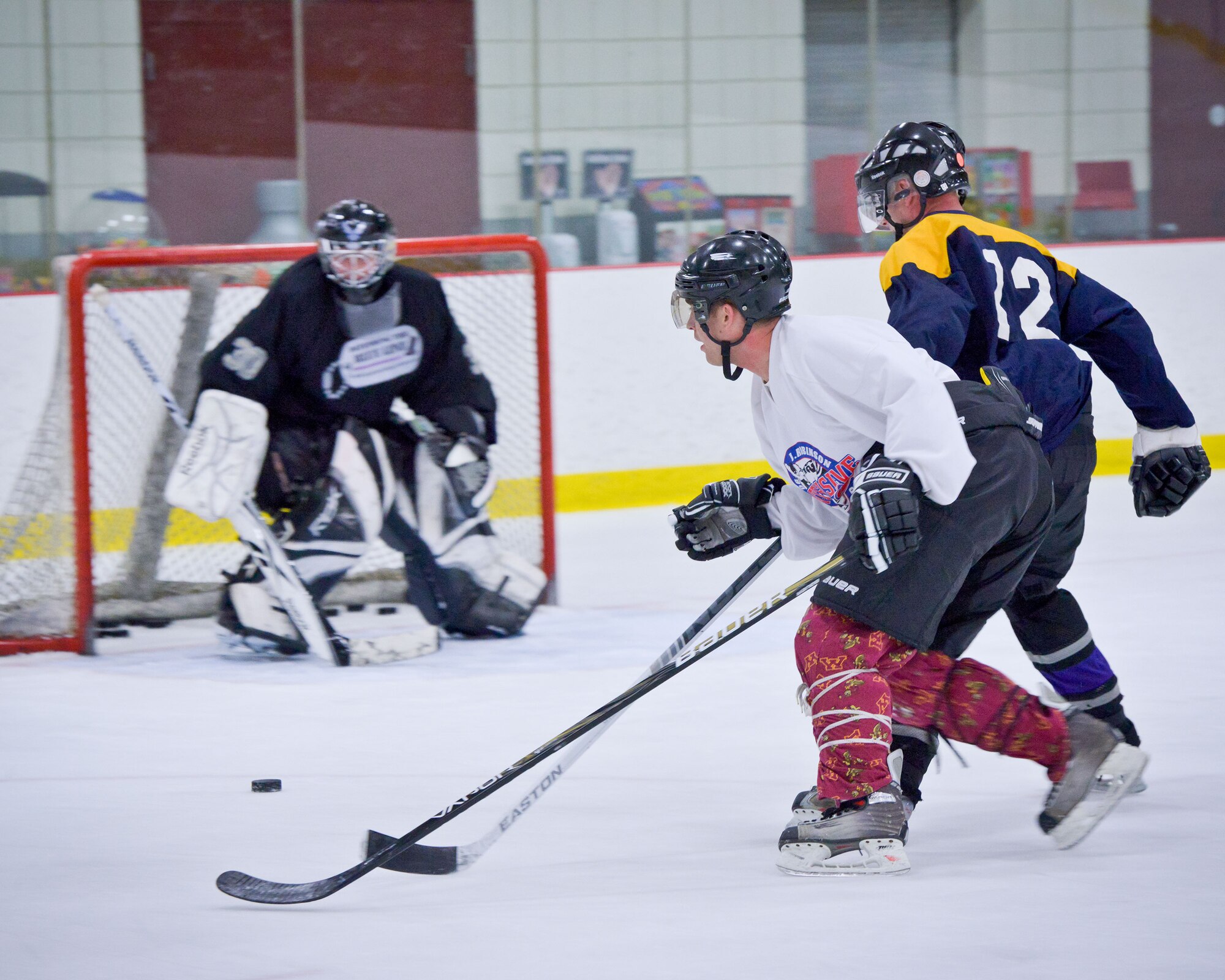 Col. Cam LeBlanc, 934th Maintenance Group commander, defends the goal.  Members of the 934th Airlift Wing play against each other in a friendly game of hockey at the Wakota Civic Arena after the June Unit Training Assembly weekend.  (U.S. Air Force photo/Shannon McKay)