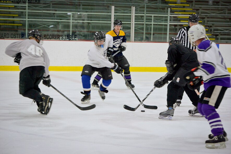 Members of the 934th Airlift Wing play against each other in a friendly game of hockey at the Wakota Civic Arena after the June Unit Training Assembly weekend.  (U.S. Air Force photo/Shannon McKay)