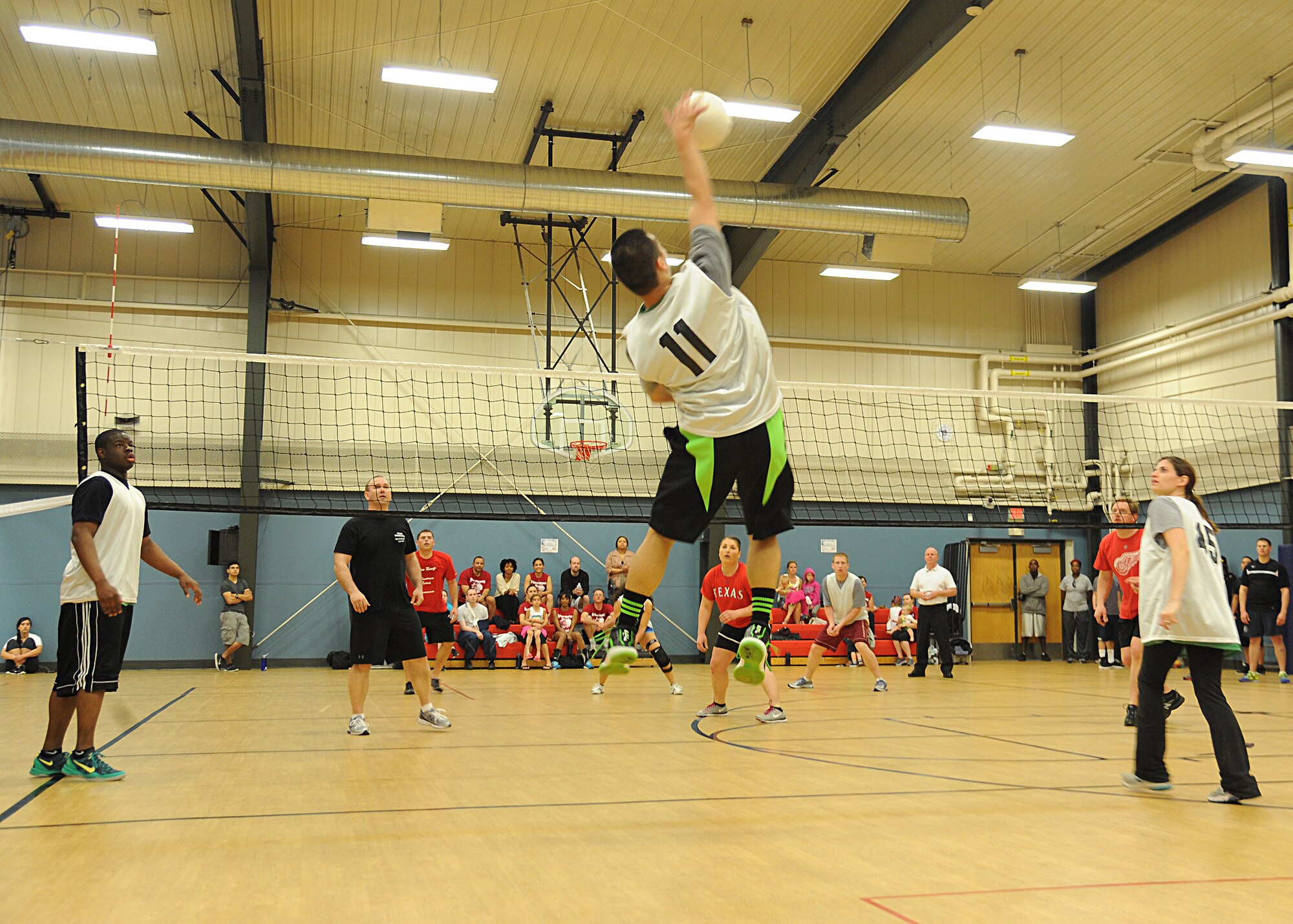 Airman 1st Class Paul Ilagan, 319th Medical Operations Squadron, medical technician, spikes the ball, May 29, 2013, at the Fitness Center, on Grand Forks Air Force Base, N.D. The Med Group defeated the 319th Civil Engineer Squadron 15-11, winning the intramural volleyball championship. (U.S. Air Force photo/Airman 1st Class Xavier Navarro)