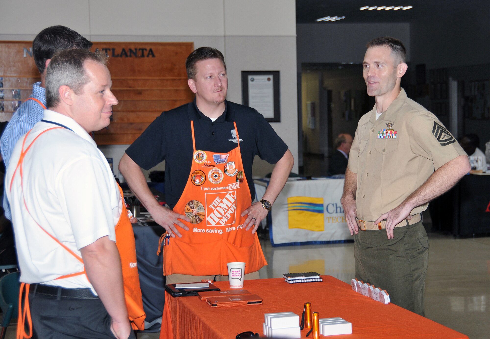 A Marine is briefed on several potential job opportunities with local companies such as Home Depot. Over 180 Marines in the Individual Ready Reserve program were selected to attend the 2013 Marine IRR Muster on June 9 at the Navy Operations Support Center here (U.S. Air Force photo/Senior Airman Elizabeth Van Patten)