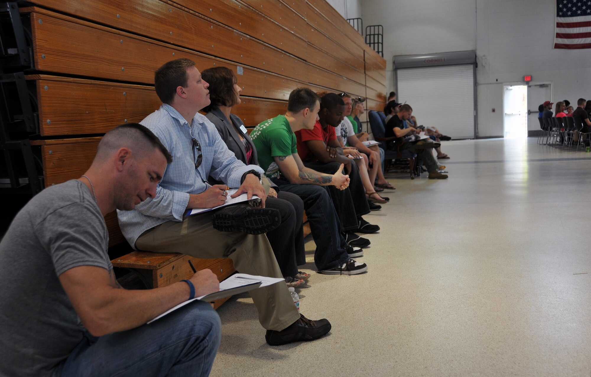 Marines in the Individual Ready Reserve program await the beginning of a muster on June 9 at the Navy Operations Support Center here. Over 180 Marines in the Individual Ready Reserve program were selected to attend the 2013 Marine IRR Muster where they were briefed on information regarding veterans’ benefits, education options, reenlistment options, job placement opportunities and information regarding issues in the military such as suicide prevention. (U.S. Air Force photo/Senior Airman Elizabeth Van Patten)