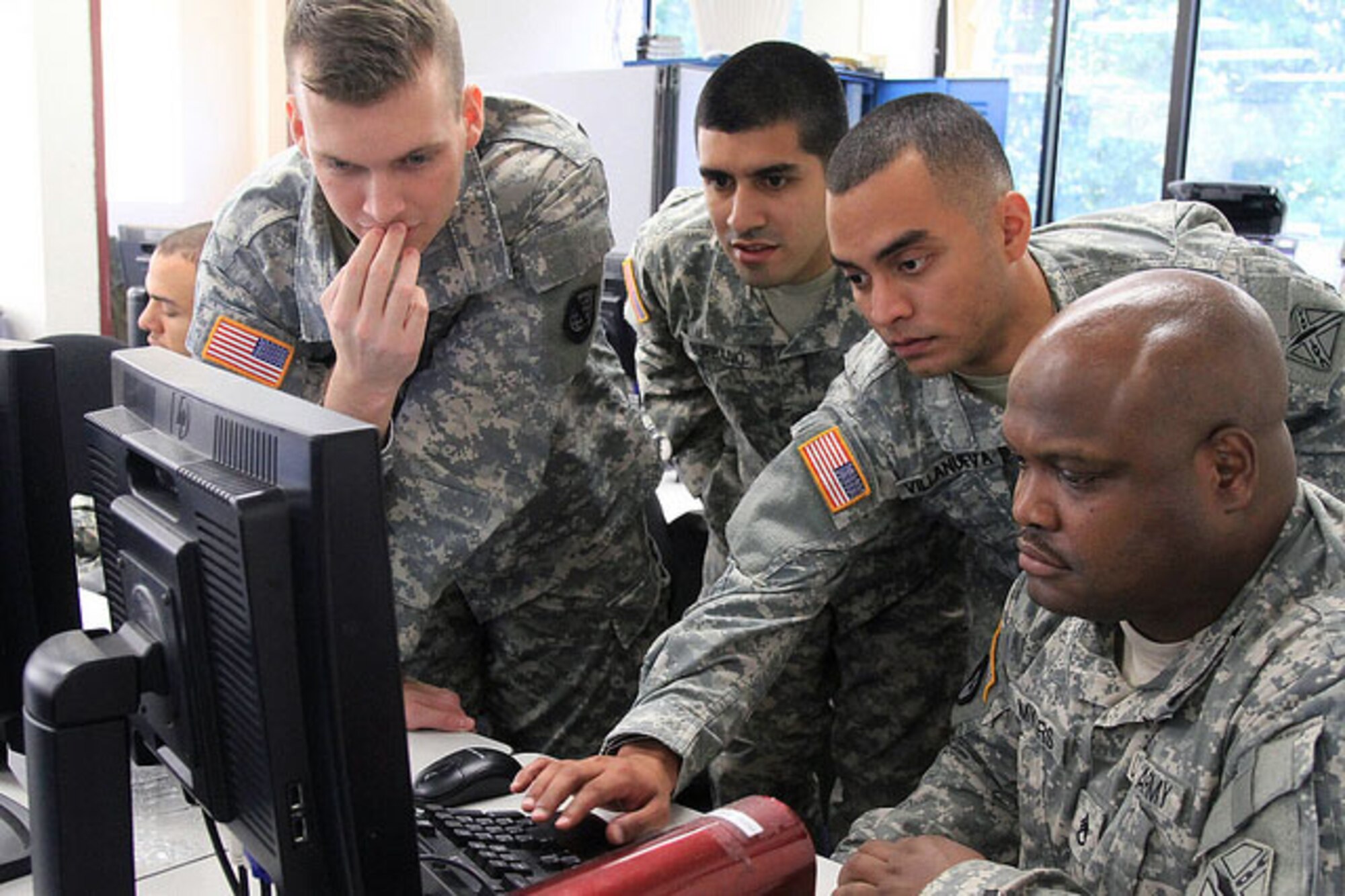 Soldiers from the Fairfax, Va.-based Data Processing Unit conduct a computer network defense exercise Sept. 15, 2012, in Fairfax. The exercise used different cyber scenarios of varying difficulty in order to evaluate the proficiency levels of the unit's Soldiers in computer network defense. (Photo by Cotton Puryear, Virginia National Guard Public Affairs)
