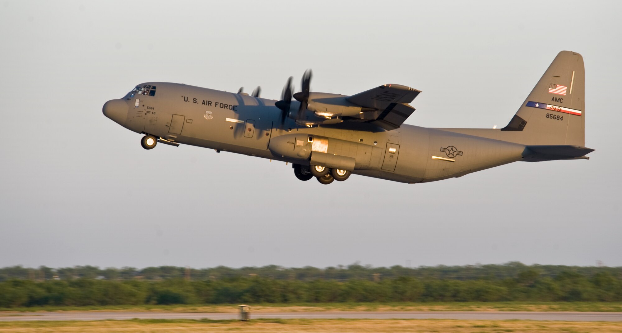 A 317th Airlift Group (AG) C-130J takes off, headed to Pope Army Airfield, N.C., in support of the Denton Program June 4, 2013, at Dyess Air Force Base, Texas. The Denton Amendment allows the U.S. military aircraft to transport, on a space-available basis, humanitarian supplies from non-government organizations to people around the world who are in need of assistance.  The 317th AG transported the supplies to Pope Army Airfield, N.C., where it will be taken to Joint Base Charleston Air Base, S.C., and then to Afghanistan. The supplies were donated by Global Samaritan Resources. (U.S. Air Force photo by Senior Airman Jonathan Stefanko/Released)

