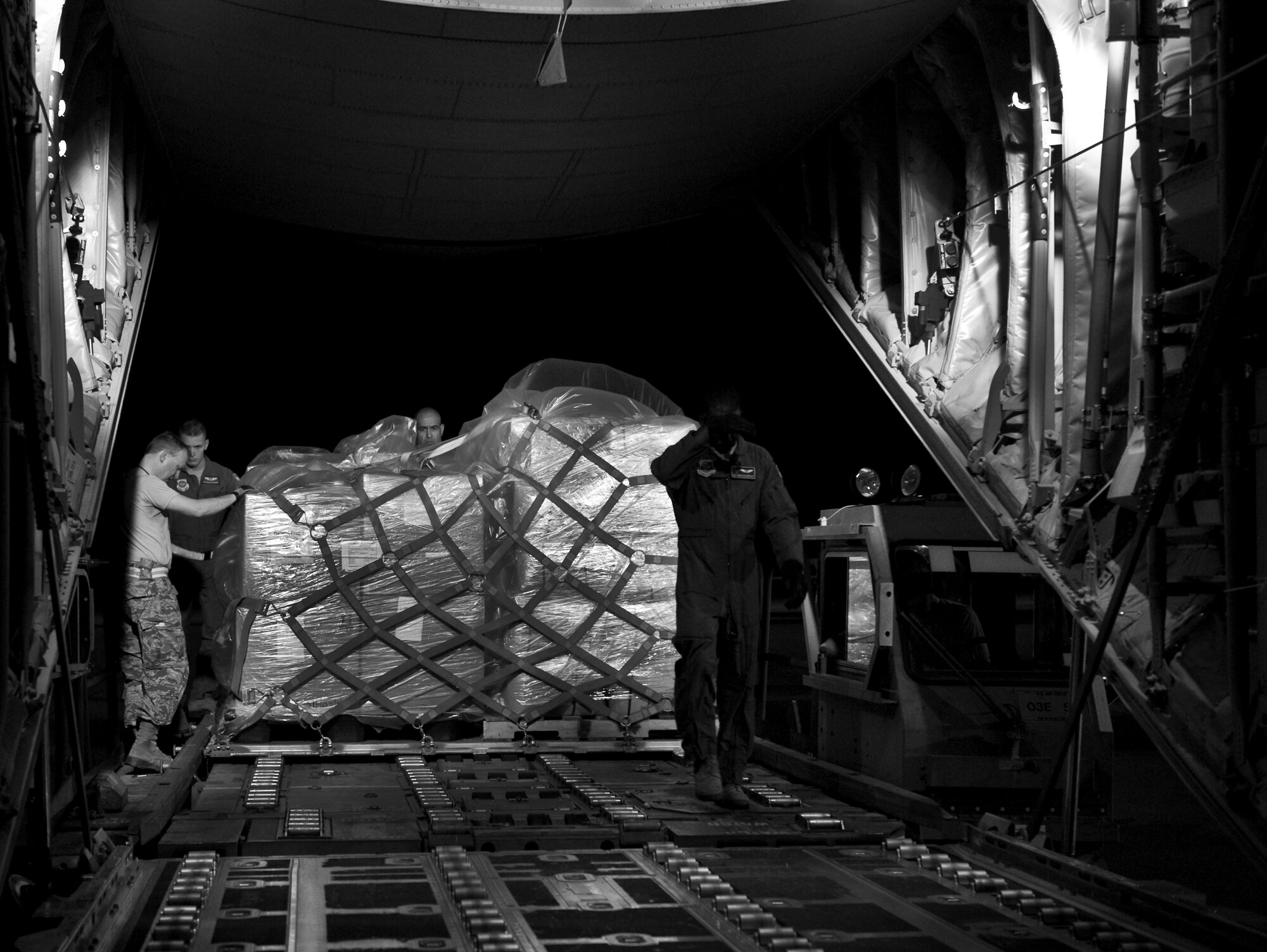 Airmen from the 317th Airlift Group (AG) load humanitarian supplies onto a C-130J in support of the Denton Program June 4, 2013, at Dyess Air Force Base, Texas. The Denton Amendment allows U.S. military aircraft to transport, on a space-available basis, humanitarian supplies from non-government organizations to people around the world who are in need of assistance. The 317th AG transported the supplies to Pope Army Airfield, N.C., where it will be taken to Joint Base Charleston Air Base, S.C., and then to Afghanistan. The supplies were donated by Global Samaritan Resources. (U.S. Air Force photo by Senior Airman Jonathan Stefanko/Released)