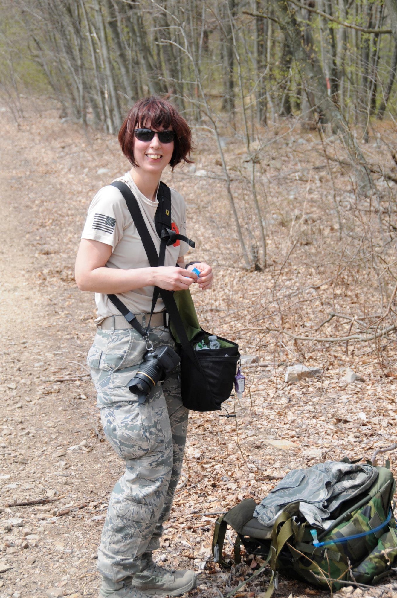 After about eight miles, Tech. Sgt. Culeen Shaffer, 193rd Special Operations Wing photojournalist, takes a break during the Second Annual Pennsylvania March for the Fallen, April 28, 2013. Sergeant Shaffer was one of 497 people registered to march 28 miles at Fort Indiantown Gap, PA., in honor of Pennsylvania Guardsmen who have fallen in combat since 9/11. (U.S. Army National Guard photo by Sgt. Neil Gussman/Released)