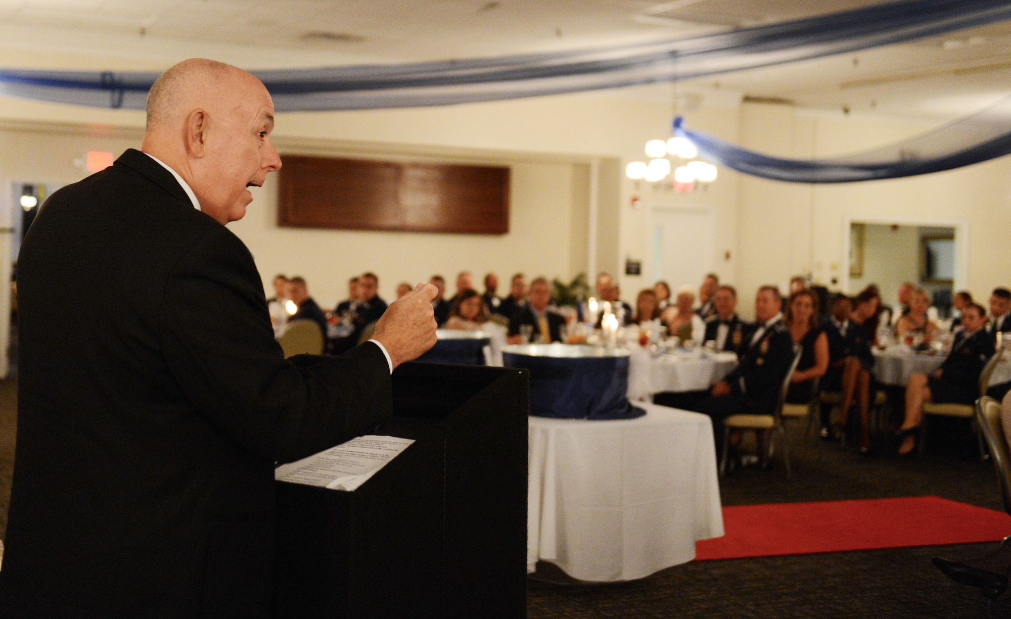 Retired Chief of Staff of the U.S. Air Force Gen. Michael Moseley, speaks to Shaw members during Team Shaw's first Dining Out event, Shaw Air Force Base, S.C., June 8, 2013. The event was sponsored by Air Force Sergeants Association, Shaw Diamond Council, Shaw Top 3, Shaw 5/6, Shaw Rising Four Council and the Shaw Enlisted Spouses Club. (U.S. Air Force photo by Senior Airman Tabatha Zarrella/Released)
