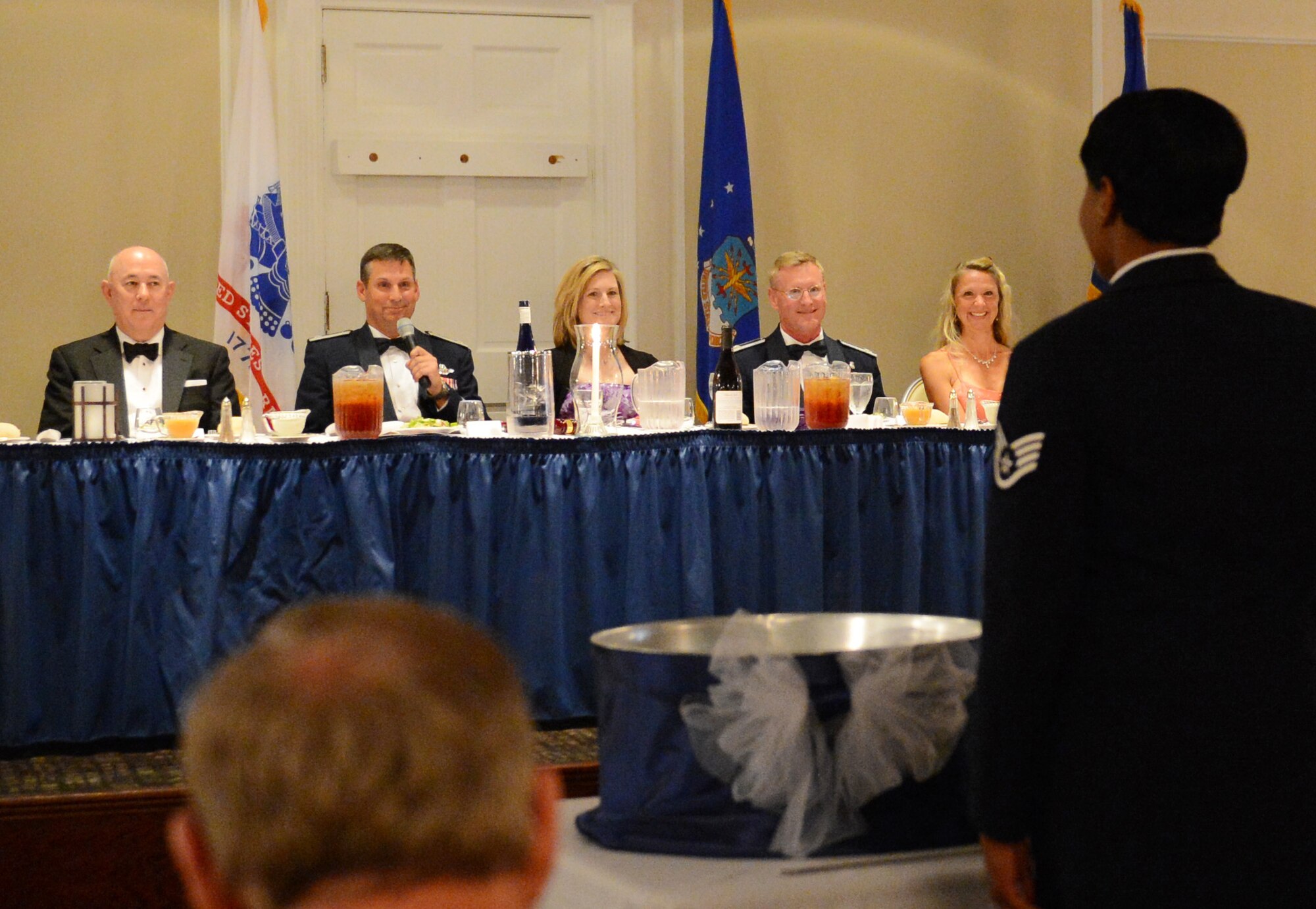 U.S. Air Force Col. Clay Hall, 20th Fighter Wing commander, instructs an Airman on the rules of the mess (Team Shaw members attending the event) during Team Shaw's first Dining Out event, Shaw Air Force Base, S.C., June 8, 2013.The event was sponsored by Air Force Sergeants Association, Shaw Diamond Council, Shaw Top 3, Shaw 5/6, Shaw Rising Four Council and the Shaw Enlisted Spouses Club. (U.S. Air Force photo by Senior Airman Tabatha Zarrella/Released)
