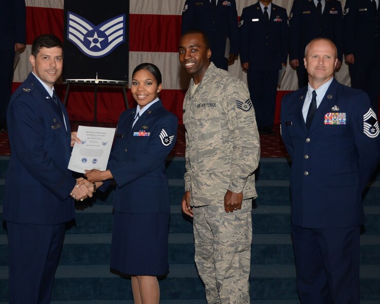 Staff Sgt. Monique Wilkins, 2nd Operations Support Squadron, receives a certificate of promotion to staff sergeant from Col. Andrew Gebara, 2nd Bomb Wing commander, during the June Wing Promotion Ceremony on Barksdale Air Force Base, La., June 3, 2013. (U.S. Air Force photo/Staff Sgt. Amber Corcoran)