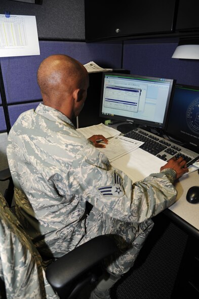 Senior Airman Ryan Pride, 442nd Services Flight technician, enters scores in the computer after administering a physical training test June 8, 2013. The 442nd Services Flight is part of the 442nd Force Support Squadron within the 442nd Fighter Wing, an A-10 Thunderbolt II Air Force Reserve Unit at Whiteman Air Force Base, Mo. (U.S. Air Force photo by Senior Airman Mike Addis/Released)