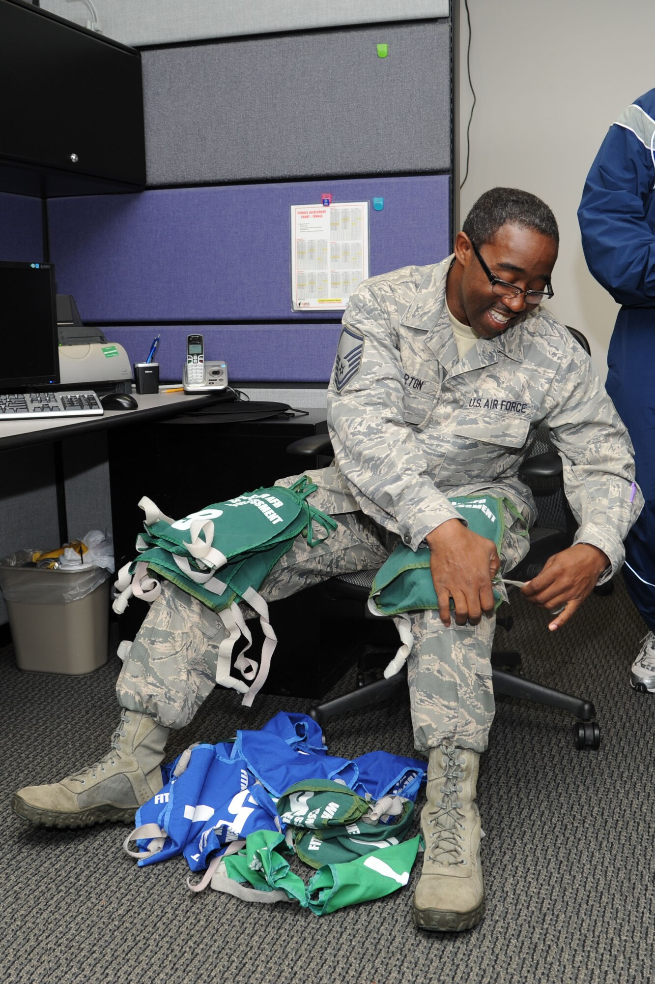 Master Sgt. Eddie Norton, 442nd Services Flight technician, folds jersies prior to administering a physical training test June 8, 2013. The 442nd Services Flight is part of the 442nd Force Support Squadron within the 442nd Fighter Wing, an A-10 Thunderbolt II Air Force Reserve Unit at Whiteman Air Force Base, Mo. (U.S. Air Force photo by Senior Airman Mike Addis/Released)
