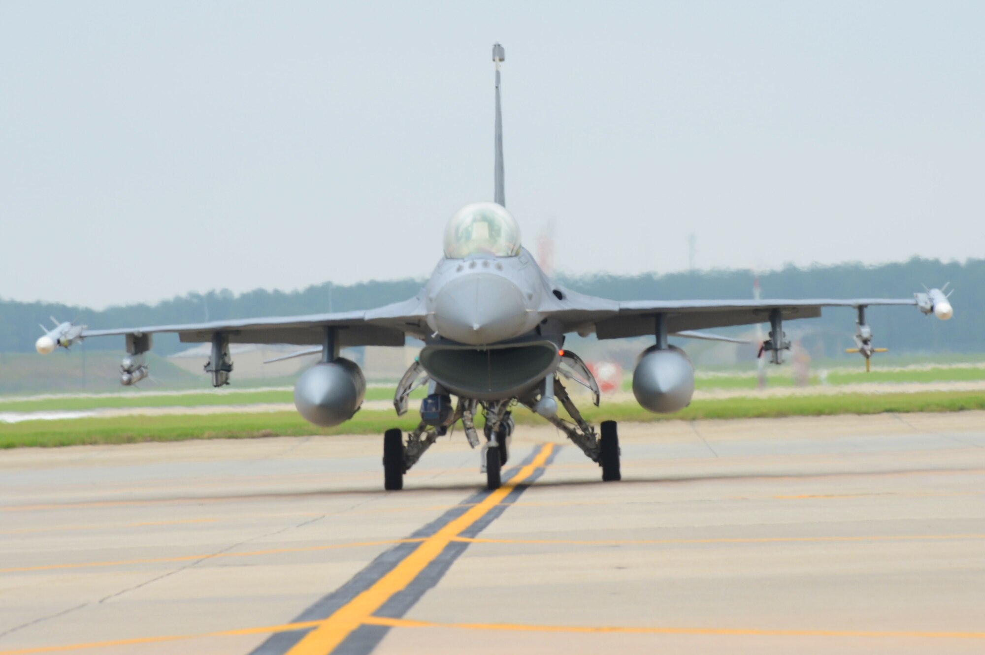 An F-16 Fighting Falcon taxies on the runway at Shaw Air Force Base, S.C., June 5, 2013.  The 77th crew chiefs work around-the-clock, launching and recovering F-16s for training and real-world combat scenarios. (U.S. Air Force photo by Airman 1st Class Nicole Sikorski/Released)  