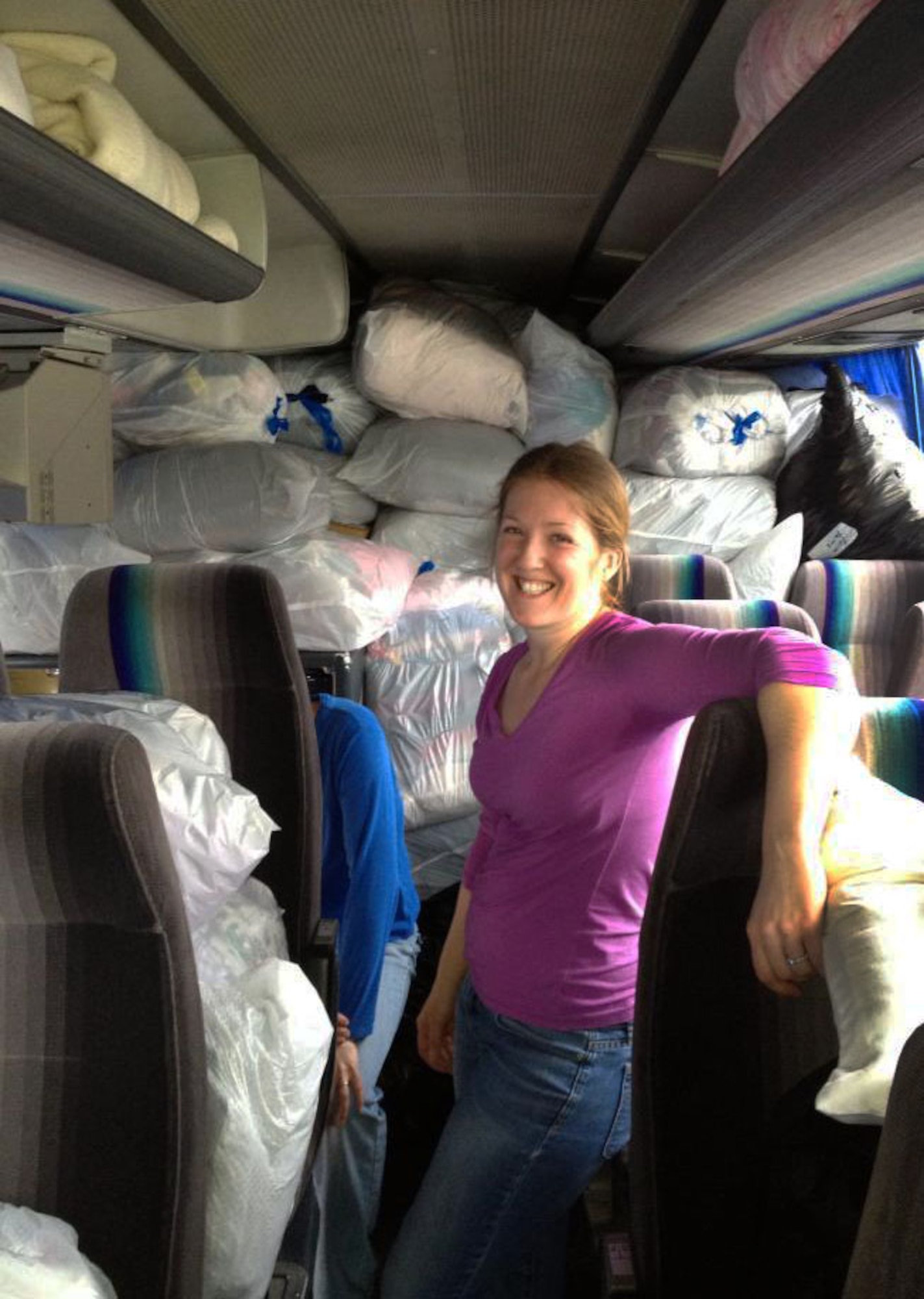 LWOWEK SLASKI, Poland – Rania Corn from Ramstein Air Base, Germany, helped stuff the bus with 320 bags of clothes. Corn's mantra, "No Bag Left Behind," not only kept the team's spirit positive, but also allowed every donation from the Spangdahlem, Ramstein and Sweinfurt communiities to make the trip to the Elim Christian Center in Lwowek Slaski, Poland. The clothes were sorted at the center and distributed to people in need throughout the surrounding communities. 22 women from Spangdahlem, Ramstein and Sweinfurt, collectively known as "Hearts for Elim," went to Poland with a mission to provide medical service along with donating their time and effort to serve the people of the local community. (U.S. Air Force courtesy photo/Released)