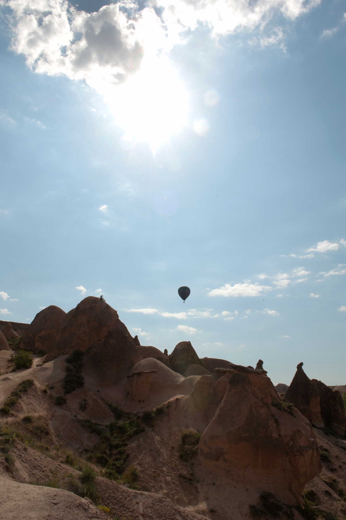 A hot air balloon soars over Imagination Valley May 5, 2013, in Nevsehir Province, Turkey. Hot air ballooning in the Cappadocia region is one of the most popular attractions in the area, allowing visitors a bird’s eye view. (U.S. Air Force photo by Senior Airman Daniel Phelps/Released)