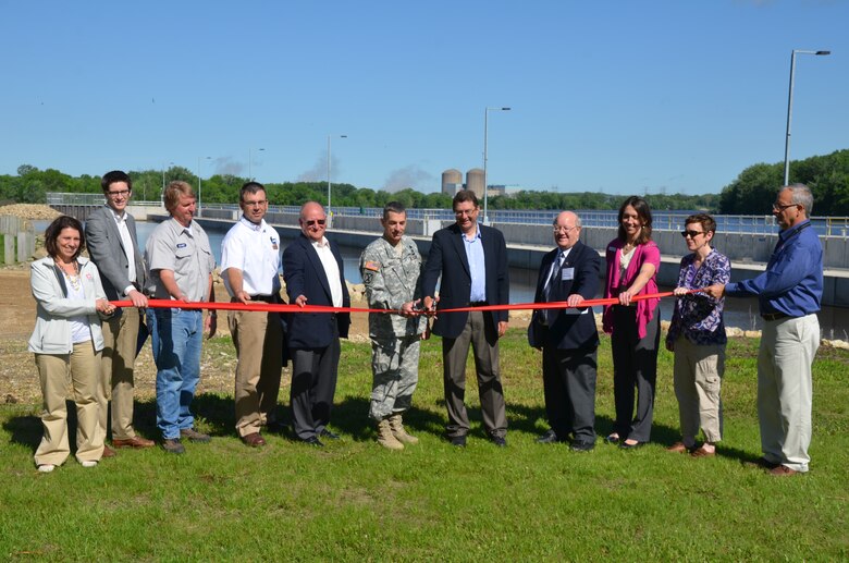 A ribbon cutting ceremony is held at Lock and Dam 3 in Welch, Minn., May 31, 2013. The event  signified the completion of the nearly $70 million dollar project that significantly improves the navigational safety of boats entering the lock.