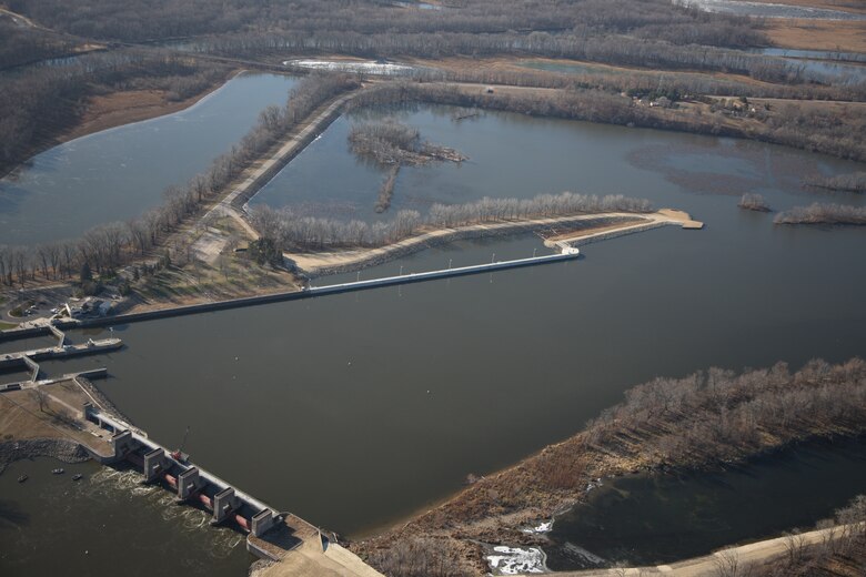 Aerial image of Lock and Dam 3 showing one of the new features, the extended 862-foot upstream guidewall. A ribbon cutting ceremony is held at Lock and Dam 3 in Welch, Minn., May 31, 2013. The event  signified the completion of the nearly $70 million dollar project that significantly improves the navigational safety of boats entering the lock.