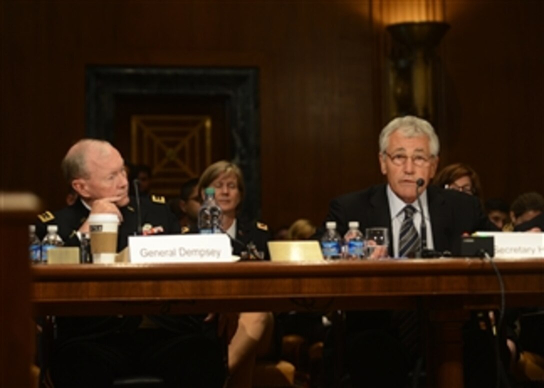 Secretary of Defense Chuck Hagel, right, testifies before the Senate Appropriations Subcommittee on Defense in the Dirksen Senate Office Building in Washington, D.C., on June 11, 2013.  Chairman of the Joint Chiefs of Staff Gen. Martin E. Dempsey joined Hagel in defending the president’s request for $526.6 billion for the Defense Department’s fiscal year 2014 budget