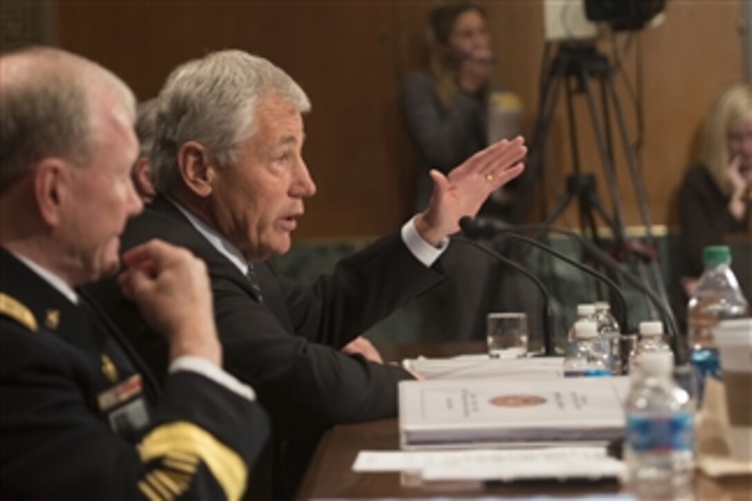 Secretary of Defense Chuck Hagel answers a senator’s question during testimony before the Senate Appropriations Subcommittee on Defense in the Dirksen Senate Office Building in Washington, D.C., on June 11, 2013.  Chairman of the Joint Chiefs of Staff Gen. Martin E. Dempsey joined Hagel in defending the president’s request for $526.6 billion for the Defense Department’s fiscal year 2014 budget.  