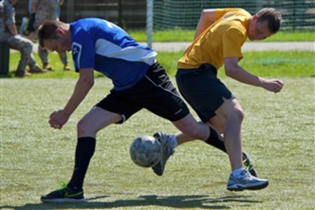U.S. Navy Petty 3rd Class Matthew Kelley competes against the Latvian navy soccer team during a Baltops 2013 tournament in Ventspils, Latvia, June 9, 2013. The annual, multinational exercise is designed to enhance maritime capabilities and interoperability with partner nations to promote maritime safety and security in the Baltic Sea. Kelley is assigned to the amphibious command ship USS Mount Whitney.