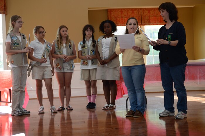 The Cadette Girl Scout Troop 6890 Marine Corps Base Quantico accept their Girl Scout Silver Award June 5, 2013 during an awards ceremony at the Lincoln Housing party room on Quantico. They earned the award for their project, “Bringing Our Community Together.”