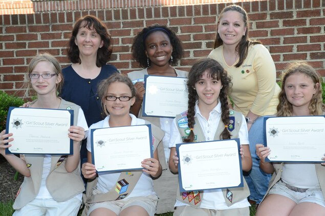 The Cadette Girl Scout Troop 6890 Marine Corps Base Quantico were awarded the Girl Scout Silver Award June 5, 2013. The award was for the more than 50 hours they spent organizing events for people in their community. Their project was called, “Bringing Our Community Together.”