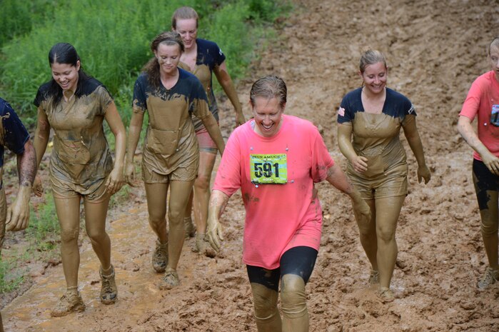 Participants in the Marine Corps Marathon's Run Amuck event walk up the final hill June 8, 2013. More than 3,000 people participated in the 3.5-mile Run Amuck race around Marine Corps Base Quantico.. Participants ran though the woods, over the hills and into mud pits.