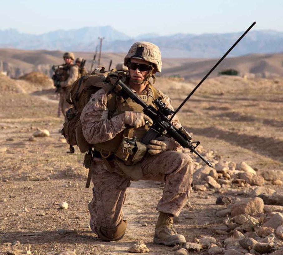 U.S. Marine Corps Capt. Paul Gates, commanding officer, Weapons Company, 3rd Battalion, 4th Marine Regiment, pauses during a dismounted patrol with Afghan National Civil Order Policemen during Operation California in Kajaki district, Helmand province, Afghanistan, April 28, 2013. He is wearing the Marine Corps combat utility uniform with its unique Marine digital pattern. Marine Corps Systems Command and the Army Natick Soldier Research, Development and Engineering Center received the 2013 Millson Award from the American Association of Textile Chemists and Colorists for the uniform's design and innovations. 
