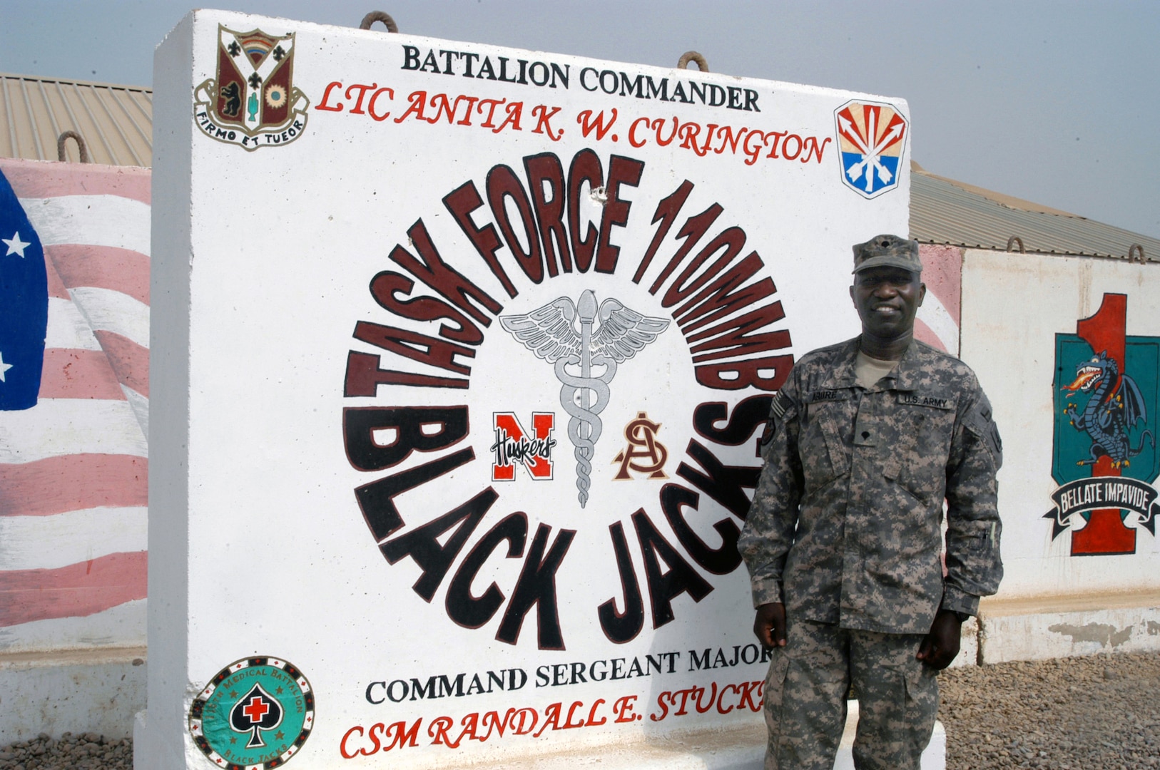 A Sudanese refugee at 16, his father dead in a civil war, Titus Abure came to the United States alone at 25 years old. He enlisted in the National Guard at 38 to give something back and, at 41, he is serving as a paralegal with the Nebraska National Guard's 110th Multifunctional Medical Battalion at Victory Base Complex, Iraq, where he's seen here on Oct. 22, 2008.