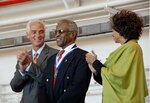 Florida Gov. Charlie Crist congratulates Lt. Col. Alton Yates, 72, after presenting him with the Governor's Medal of Merit last month while Gwen Yates, his wife of more than 40 years, looks on. As the state's highest award, the medal is reserved for those in the military who have demonstrated exceptional service while on duty.