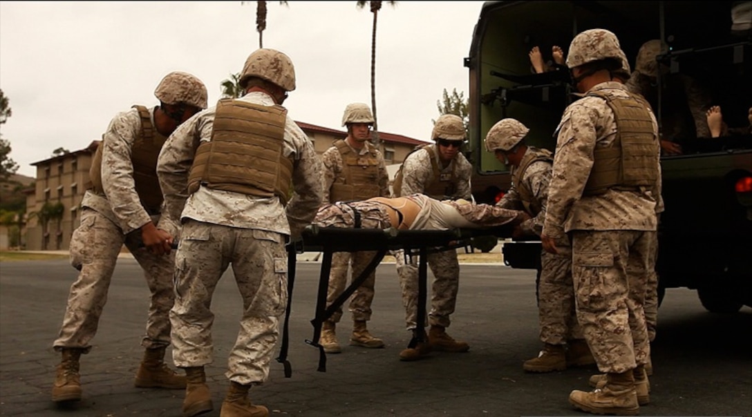 Corpsmen with 1st Medical Battalion, 1st Marine Logistics Group, transport a simulated casualty victim to the shock trauma platoon tent during the first public mass casualty drill aboard Camp Pendleton, Calif., June 5, 2013. Marines and sailors demonstrated their emergency response skills to several friends and families that attended the event. 