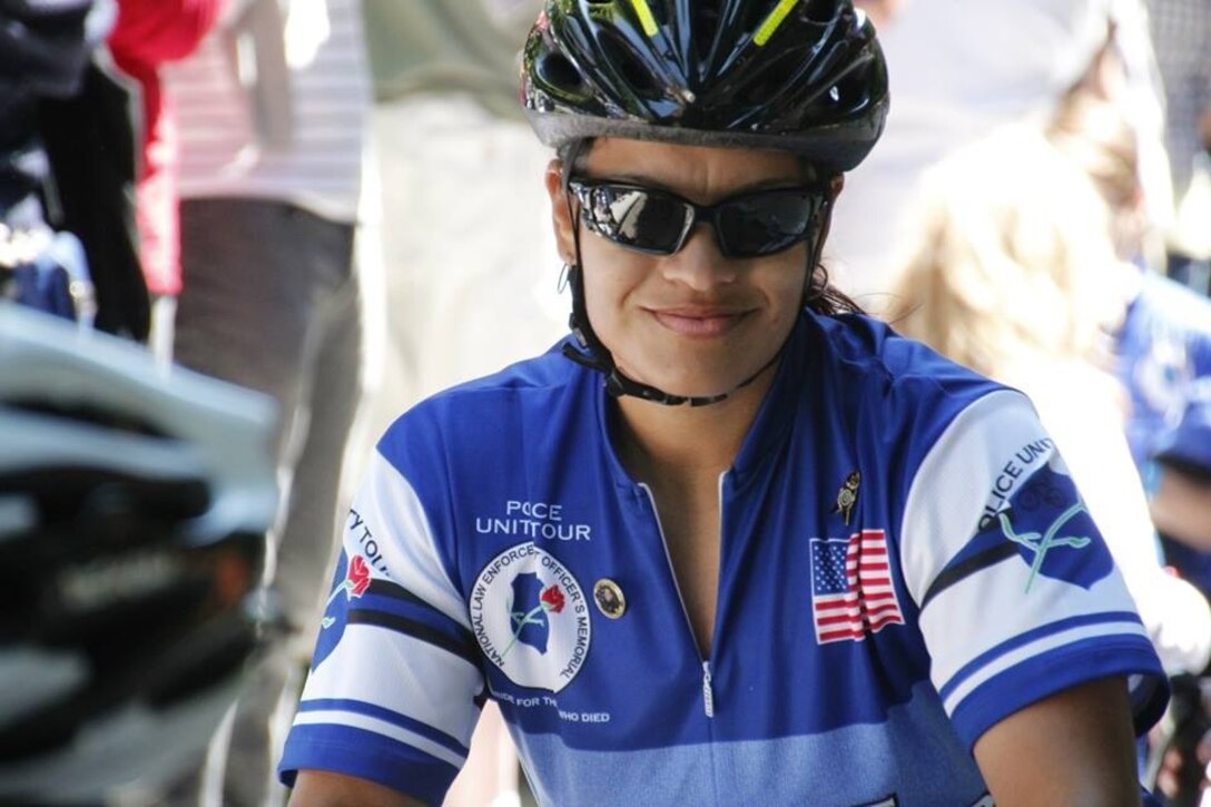 Police Sgt. Valerie Torres, a desk sergeant with the Provost Marshal’s Office aboard Marine Corps Air Station Miramar, Calif., and a Loveland, Colo., native, poses for a photo during the 2013 Police Unity Tour, May 11. Torres represented MCAS Miramar and the fallen officer Jared Francom in the tour. (Photo provided by Police Sgt. Valerie Torres)

