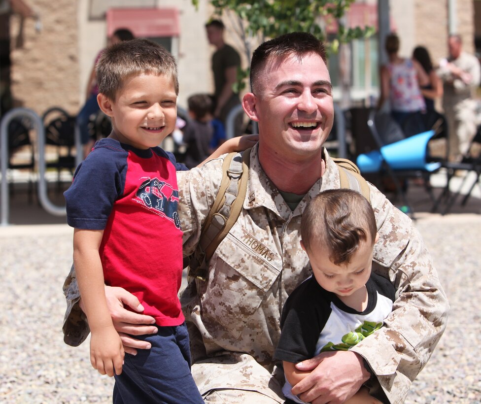 Captain Jeremy Thomas, commanding officer, Headquarters and Service Company, Combat Logistics Battalion 7, Combat Logistics Regiment 1, 1st Marine Logistics Group, and a native of Palm Coast, Fla., is greeted by his family after returning from a deployment to Afghanistan during a welcome home aboard Camp Pendleton, Calif., June 8, 2013.