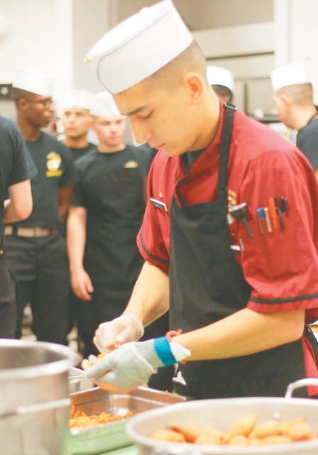 Lance Cpl. Nicholas Casas, team 2, prepares sweet-baby yams for his first Chef of the Quarter competition at Phelps Mess Hall May 30, 2013.