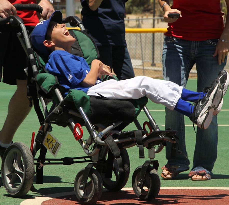 Reed Luckino, 12, approaches the plate at the Miracle League of the Desert's opening day celebration after the 2013 Grubstake Days Parade in Yucca Valley May 25.