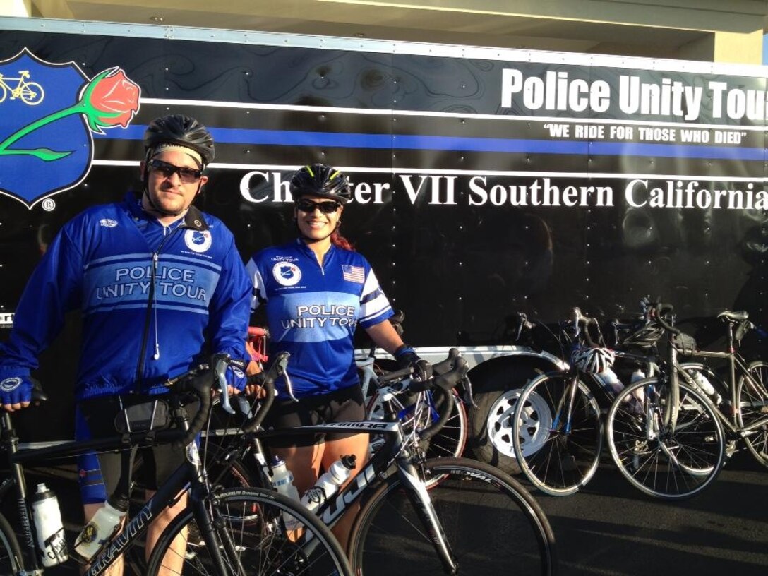 Police Sgt. Valerie Torres, right, a desk sergeant with the Provost Marshal’s Office aboard Marine Corps Air Station Miramar, Calif., and a Loveland, Colo., native, stands with a fellow police officer during the 2013 Police Unity Tour, May 11. The tour raised awareness for the National Law Enforcement Officer's Memorial Fund and honored fallen officers. (Photo provided by Police Sgt. Valerie Torres)  