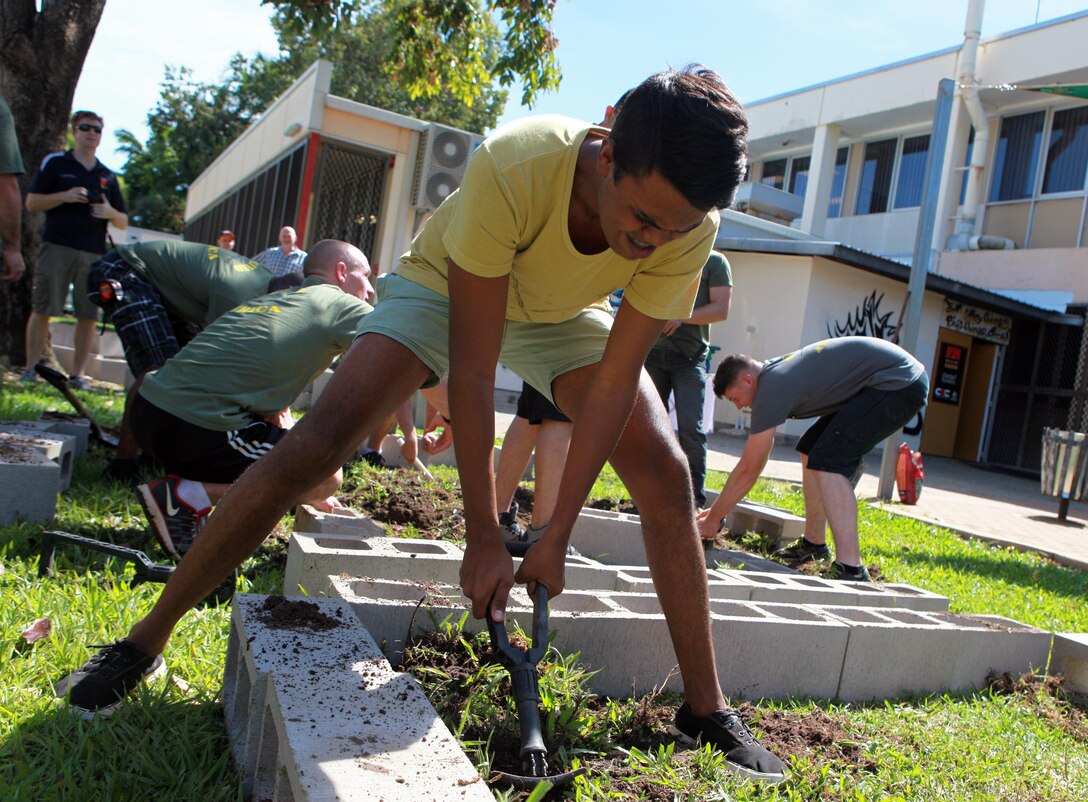 Joel Greenoff, a Casuarina Senior College student and member of the Clontarf Foundation digs up dirt at the gardening site at the school, here, May 30. Marines with Marine Rotational Force - Darwin helped students with the foundation build a vegetable garden funded by the Consulate General of the United States, Melbourne. MRF-D Marines volunteer at the school every Thursday to help with projects like this and provide mentorship.