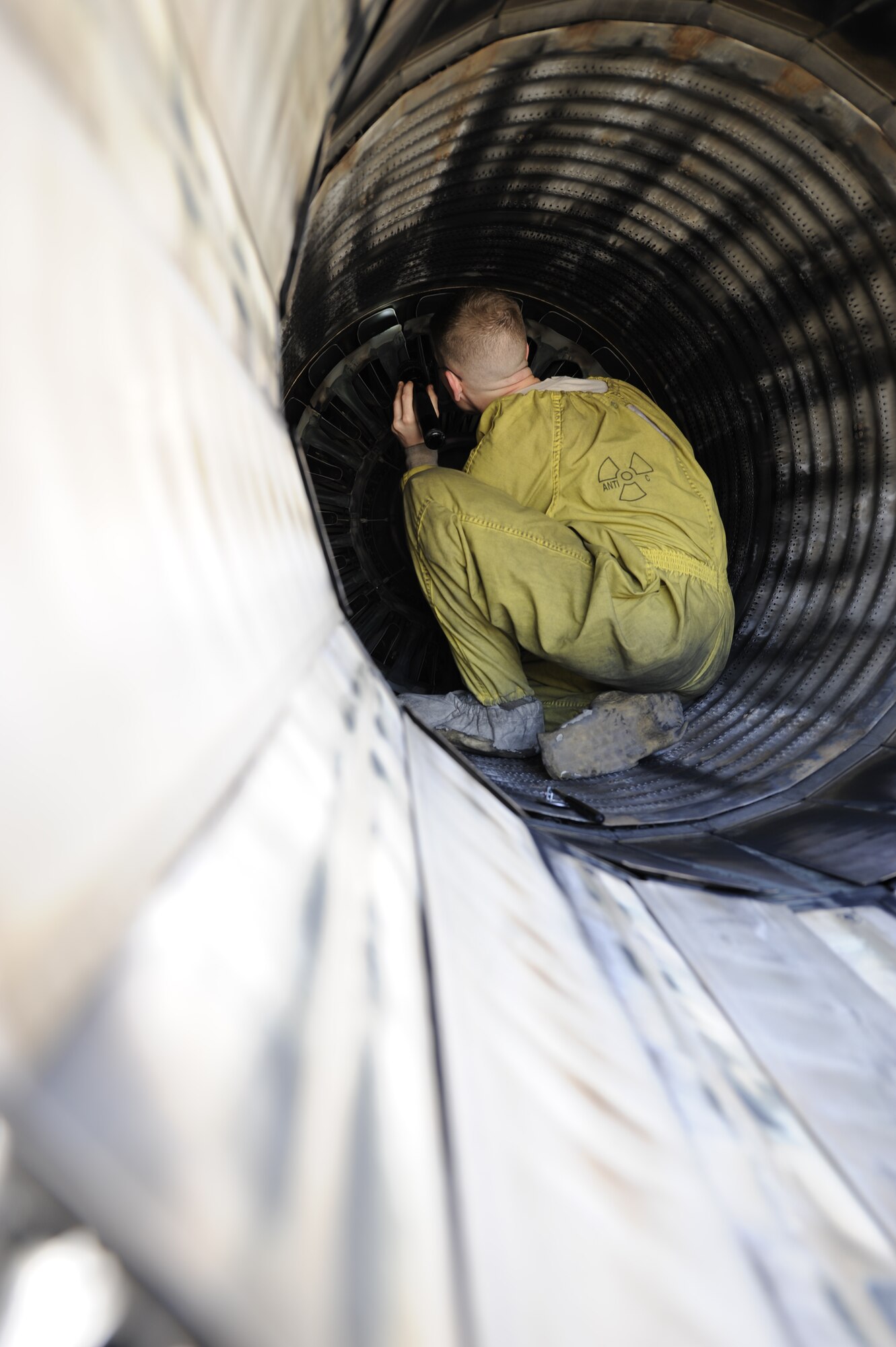KUNSAN AIR BASE, Republic of Korea—Staff Sgt. John Sweeney, 4th Expeditionary Fighter Squadron, 4th Expeditionary Maintenance Unit crew chief, inspects the exhaust fins of an F-16 Fighting Falcon at Kunsan Air Base, Republic of Korea, April 3, 2013. Post flight inspections of the intake and exhaust fins are accomplished on an aircraft after each flight to ensure the pilot a safe flight. (U.S. Air Force photo by Staff Sgt. Tong Duong/released)