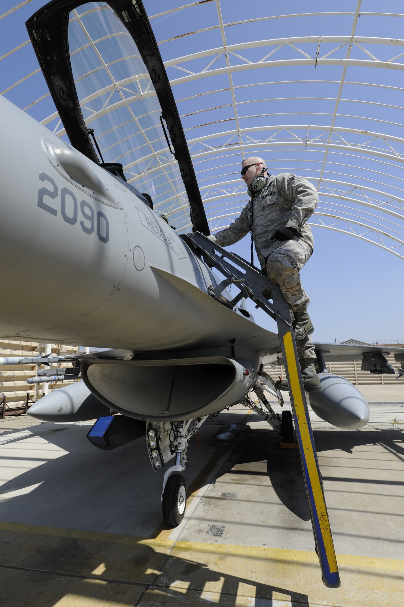 KUNSAN AIR BASE, Republic of Korea—Staff Sgt. David Cook, 4th Expeditionary Fighter Squadron, 4th Expeditionary Maintenance Unit crew chief, talks to a pilot after recovering the F-16 Fighting Falcon at Kunsan Air Base, Republic of Korea, April 3, 2013. Cook was part of the theater support package, deployed from Hill Air Force Base, Utah. More than 240 aircraft maintainers and support personnel were part of the TSP. (U.S. Air Force photo by Staff Sgt. Tong Duong/released)