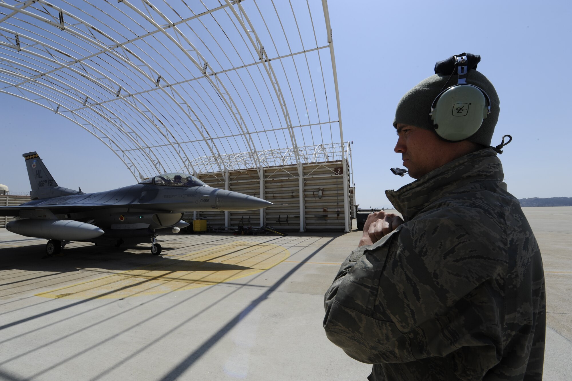 KUNSAN AIR BASE, Republic of Korea—Senior Airman Kenneth Peterson, 4th Expeditionary Fighter Squadron, 4th Expeditionary Maintenance Unit, recovers an F-16 Fighting Falcon at Kunsan Air Base, Republic of Korea, April 3, 2013. Peterson was  deployed from Hill Air Force Base, Utah as part of the theater support package, which helped the 8th Fighter Wing increase its ability to ‘defend the base.’ (U.S. Air Force photo by Staff Sgt. Tong Duong/released)