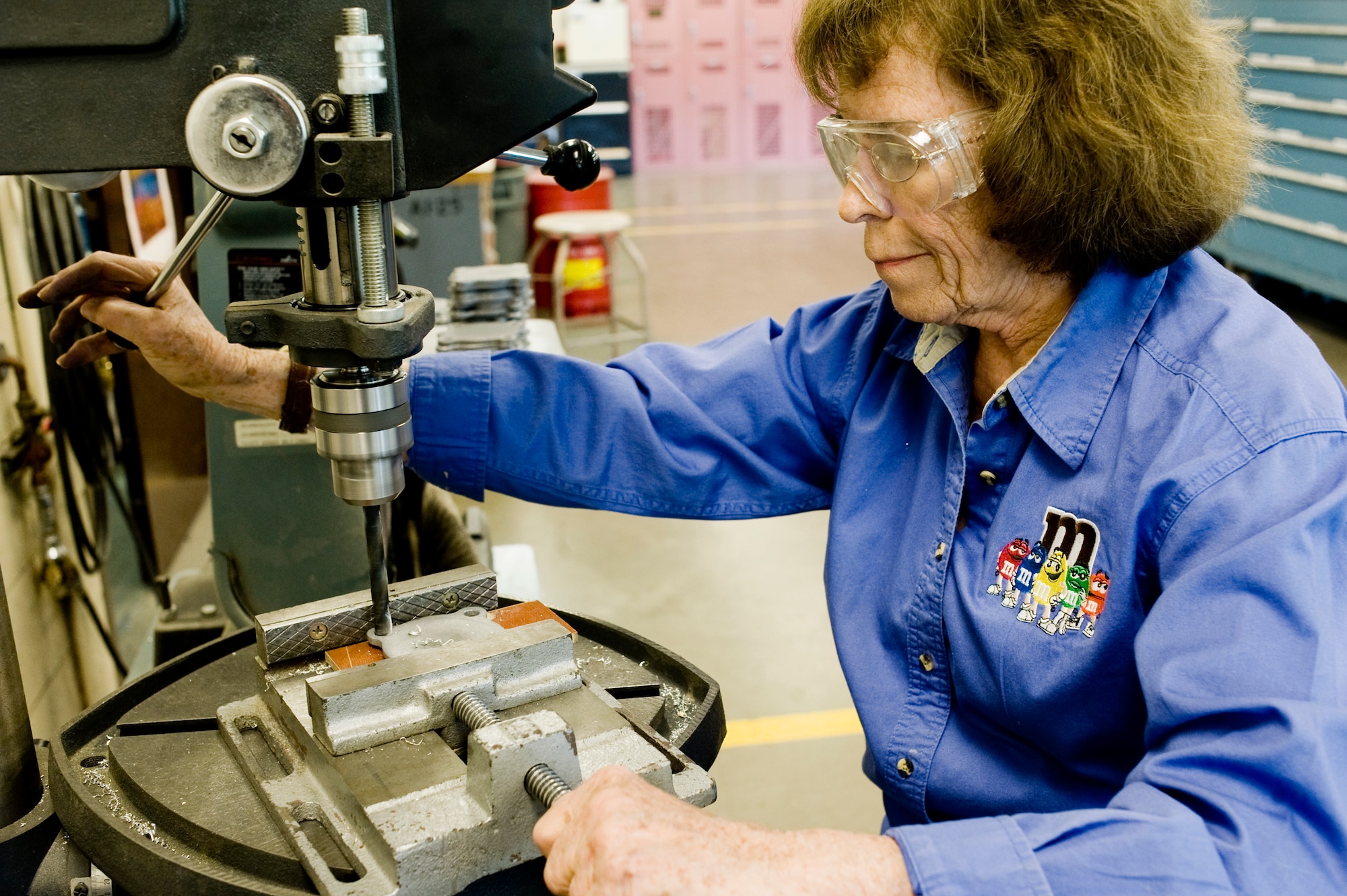 Alice Jackson drills holes in an engine plate for the SA-10 Catalina May 18, 2010 at Joint Base Lewis-McChord, Wash. Mrs. Jackson's husband was a World War II combat veteran, and also flew as a gunner in a SA-10. She volunteered at museum as part of the SA-10 crew for more than three years. (U.S. Air Force photo/Abner Guzman)