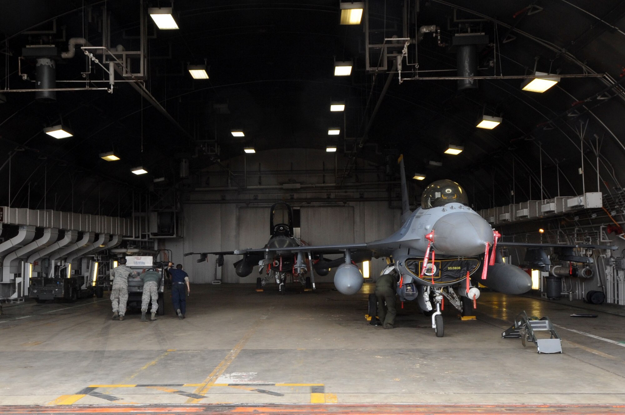 Maintainers from the 35th Aircraft Maintenance Squadron prepare to generate U.S. Air Force F-16 Fighting Falcons during an Operational Readiness Exercise at Misawa Air Base, Japan, June 12, 2013. The week-long exercise is designed to evaluate Misawa's mission readiness. (U.S. Air Force photo by Senior Airman Derek VanHorn)