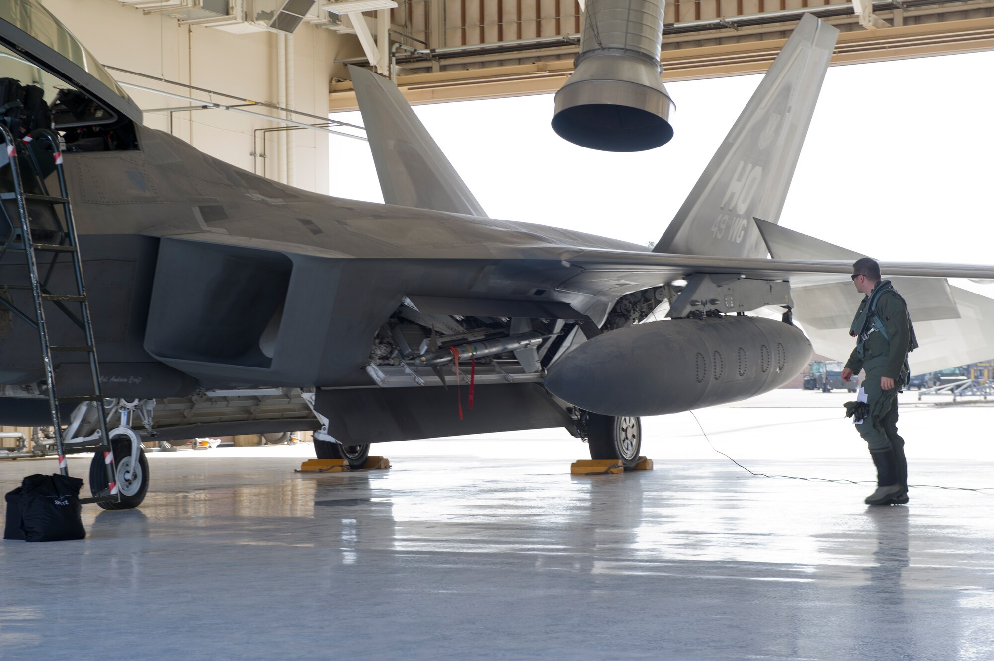 Captain Robert Burgon, 7th Fighter Squadron pilot, performs pre-flight checks before preparing to taxi to the runway in an F-22 Raptor at Holloman Air Force Base, N.M., June 7. The 7th FS flew F-22s in support of Operation Noble Eagle. ONE is the name given to the United States and Canadian military operations related to homeland security and support to federal, state, and local agencies. The ongoing operation began September 14, 2001, in response to the September 11 attacks. (U.S. Air Force photo by Airman 1st Class Aaron Montoya /Released)