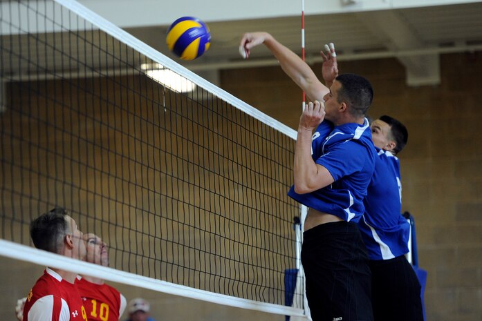 Airman 1st Class Michael, 548th Intelligence, Surveillance, and Reconnaissance Group, and a teammate block the opposing team's ball at the 2013 Armed Forces Volleyball Championship, Hill Air Force Base, Utah, May 8, 2013. After qualifying for the All-Air Force team, Michael went on to represent the Department of Defense at the 2013 USA Volleyball National Championships. (U.S. Air Force photo by Airman 1st Class Justyn M. Freeman/Released)

