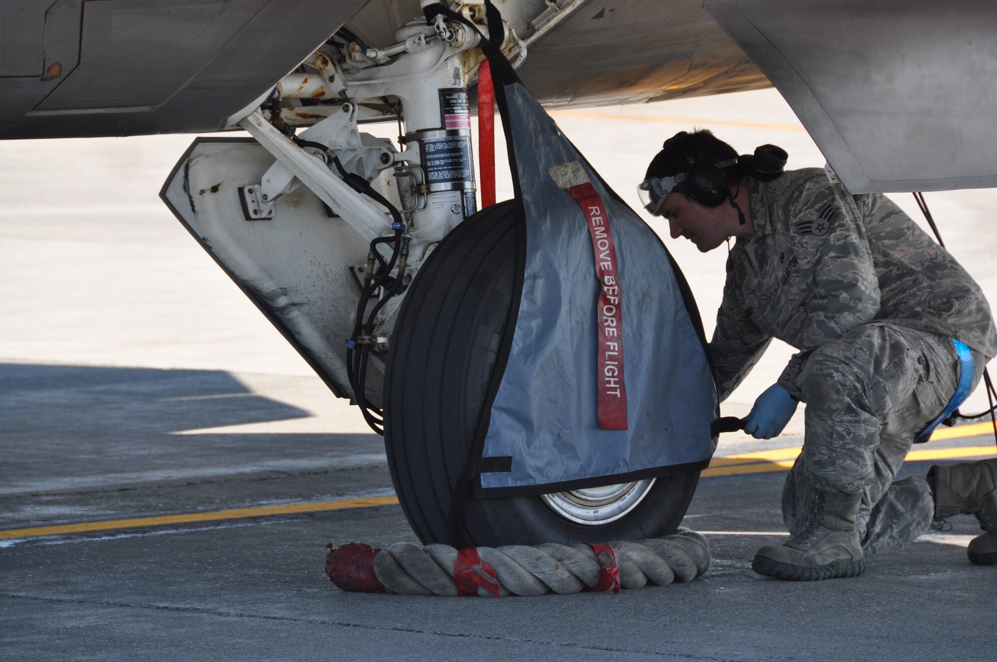 Senior Airman James Hadaway, 3rd Aircraft Maintenance Squadron avionics specialist, along with Airmen from the 3rd Aircraft Maintenance Squadron and 673rd Logistics Readiness Squadron, perform a hot pit refuel with an F-22 here. Hot pit refueling is a procedure performed in order to rapidly refuel the aircraft and allow it to complete a second sortie in a short amount of time. During a hot pit refuel the pilot will stay in the cockpit with the jet running while the maintenance crews perform safety checks and refuel the aircraft allowing it to return to flight in minimum. (U.S. Air Force/Capt. Ashley Conner) 