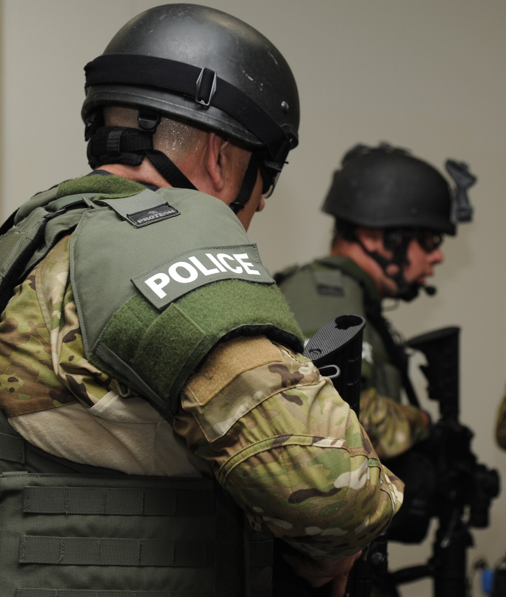 Biloxi Police Department's special response team members worked with 81st Security Forces Squadron members to engage and apprehended a portrayed gunman ending his shooting spree during Keesler's active shooter exercise, June 12, 2013, at Garrard Hall, Keesler Air Force Base, Miss.  During the two-day exercise, an Air Force couple simulated opening fire, killing three people and injuring 41.  The exercise tested the base's ability to respond to and recover from a mass casualty event.  (U.S. Air Force photo by Kemberly Groue)