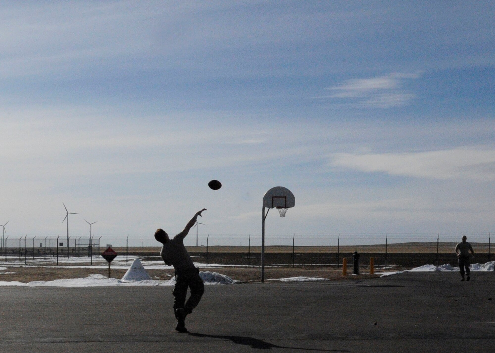 Airman 1st Class Thomas Huenink (left) and Senior Airman Jacob Petersen play catch during a break at a missile alert facility February 28, 2013, in Wyoming. The Airmen who work at the MAF live and work at the facility 24/7 during their three-or four-day shifts. Huenink and Petersen are assigned to the 90th Missile Security Forces Squadron. (U.S. Air Force photo/Tech. Sgt. Mareshah Haynes)