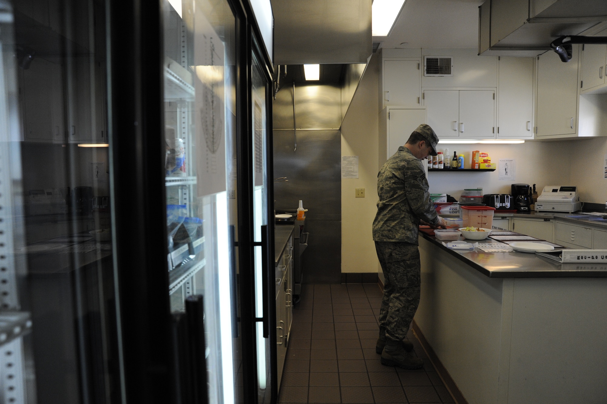 Senior Airman Christopher Kolp prepares meals for Airmen while they are working at the missile alert facility March 27, 2013, at F.E. Warren Air Force Base, Wyo. Kolp is responsible for cooking three meals a day for the crews in the MAF and performs the dining facility functions on his own. Kolp is assigned to the 320th Missile Squadron. (U.S. Air Force photo/Tech. Sgt. Mareshah Haynes)